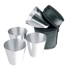A set of four 35 ml metal glasses in a case