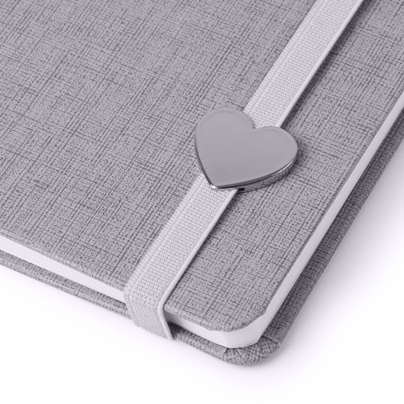 Replaceable heart metal plate for a notebook